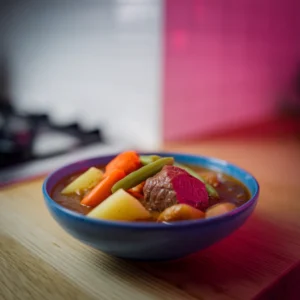 A-bowl-of-beef-stew-with-vegetables-like-potatoes-carrots-and-green-beans