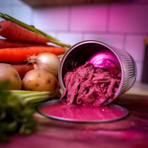 A-can-of-beef-opened-showing-shredded-beef-with-juices-next-to-fresh-vegetables