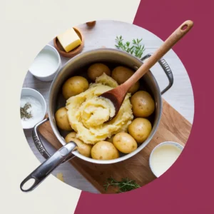 A-pot-of-freshly-boiled-potatoes-being-mashed-with-a-wooden-spoon-surrounded-by-ingredients-like-butter-milk-and-a-sprinkle-of-herbs