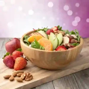 Mixed salad with apples, strawberries, and mandarin oranges.
